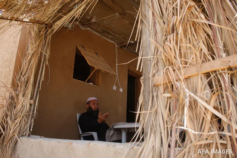 Palestinians build a house with clay, after their home was destroyed in Israel's last military operation in Gaza, in the Rafah refugee camp, southern Gaza Strip. Many parts of the Hamas-run Gaza Strip are still in ruins...