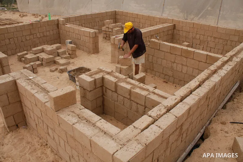 Palestinians build a house with clay, after their home was destroyed in Israel's last military operation in Gaza, in the Rafah refugee camp, southern Gaza Strip. Many parts of the Hamas-run Gaza Strip are still in ruins...