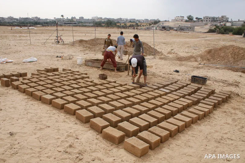 Palestinians build a house with clay, after their home was destroyed in Israel's last military operation in Gaza, in the Rafah refugee camp, southern Gaza Strip. Many parts of the Hamas-run Gaza Strip are still in ruins...