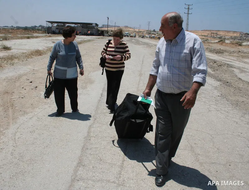 Palestinian Christians walk towards Erez crossing in the northern Gaza Strip on May 11, 2009 after Israel granted 95 permits for Christians from the isolated and impoverished territory to travel to the West Bank town of...
