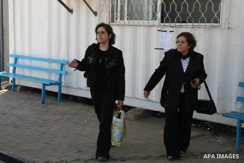 Palestinian Christians walk towards Erez crossing in the northern Gaza Strip on May 11, 2009 after Israel granted 95 permits for Christians from the isolated and impoverished territory to travel to the West Bank town of...