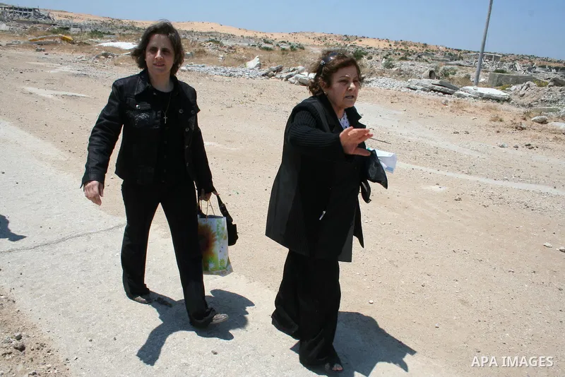 Palestinian Christians walk towards Erez crossing in the northern Gaza Strip on May 11, 2009 after Israel granted 95 permits for Christians from the isolated and impoverished territory to travel to the West Bank town of...