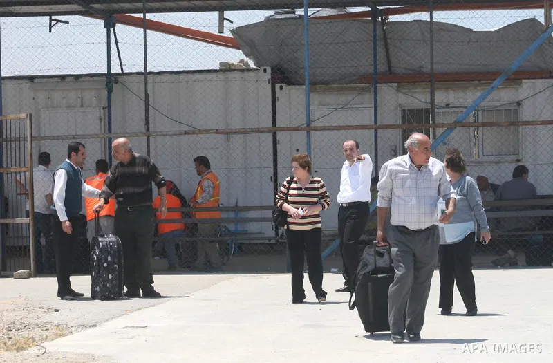 Palestinian Christians walk towards Erez crossing in the northern Gaza Strip on May 11, 2009 after Israel granted 95 permits for Christians from the isolated and impoverished territory to travel to the West Bank town of...