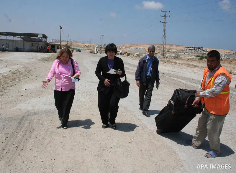 Palestinian Christians walk towards Erez crossing in the northern Gaza Strip on May 11, 2009 after Israel granted 95 permits for Christians from the isolated and impoverished territory to travel to the West Bank town of...
