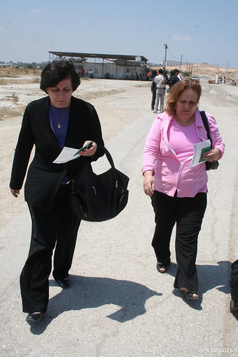Palestinian Christians walk towards Erez crossing in the northern Gaza Strip on May 11, 2009 after Israel granted 95 permits for Christians from the isolated and impoverished territory to travel to the West Bank town of...