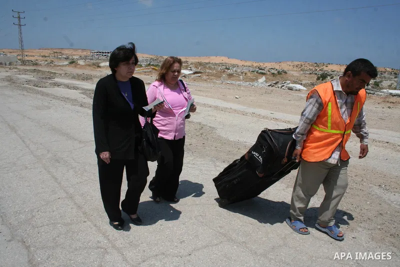 Palestinian Christians walk towards Erez crossing in the northern Gaza Strip on May 11, 2009 after Israel granted 95 permits for Christians from the isolated and impoverished territory to travel to the West Bank town of...