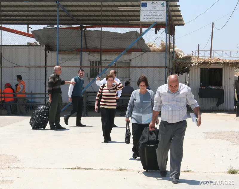 Palestinian Christians walk towards Erez crossing in the northern Gaza Strip on May 11, 2009 after Israel granted 95 permits for Christians from the isolated and impoverished territory to travel to the West Bank town of...