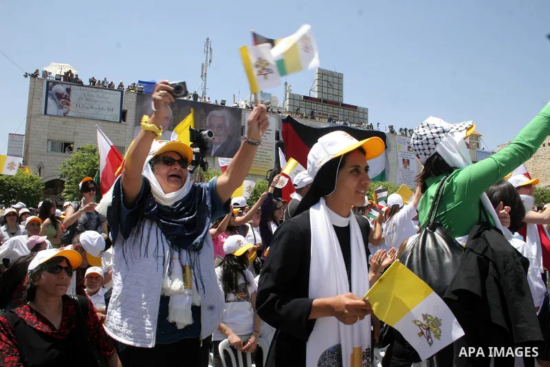 Pope Benedict XVI celebrates a Holy Mass in Manger Square May 13, 2009 in Bethlehem, West Bank. During his visit marred by controversy over his wartime past as a member of the Nazi's Hitler Youth, the Pontiff called for...