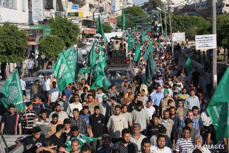 Palestinian supporters of the Islamic movement Hamas participate a rally in Gaza City, Sunday, May 31, 2009. Palestinian forces stormed a Hamas hideout in the northern West Bank, setting off a fierce battle that left six...