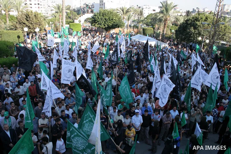 Palestinian supporters of the Islamic movement Hamas participate a rally in Gaza City, Sunday, May 31, 2009. Palestinian forces stormed a Hamas hideout in the northern West Bank, setting off a fierce battle that left six...