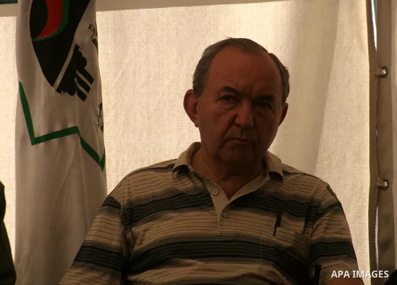 UN investigator Richard Goldstone sets with Hamas deputy Ahmed Bahrand members of his delegation in a tent as they visit the Palestinian parliament building that was destroyed during Israel's December-January offensive i...