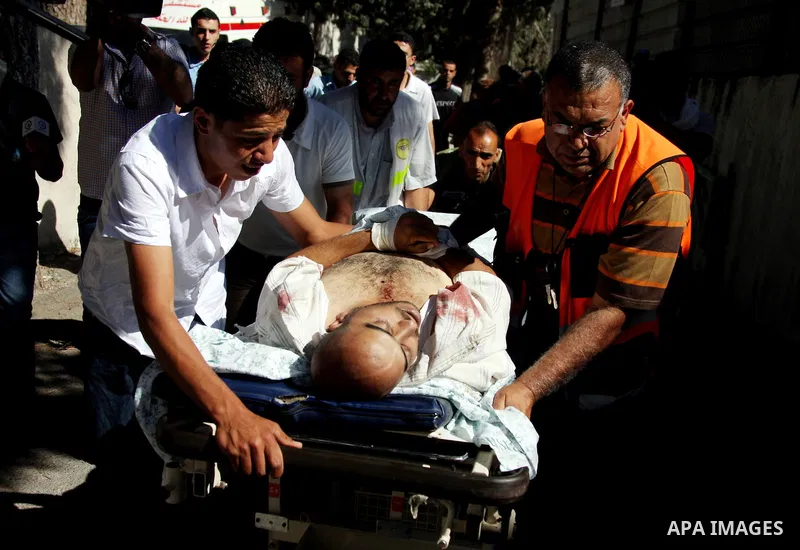 The body of Palestinian Yussef Aqil Srour is carrieed into the mortuary of a hospital in the West Bank city of Ramallah on June 5, 2009. The 35-year-old protester was shot dead by Israeli troops during a protest by some...