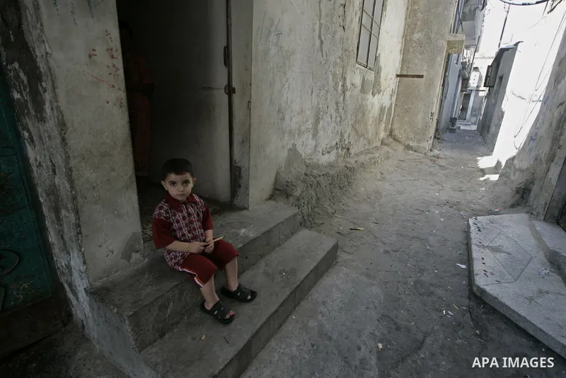 A Palestinian boys play in the streets of Rafah refugee camp southern Gaza Strip on June 10, 2009. PHOTO\Abed Rahim Khatib