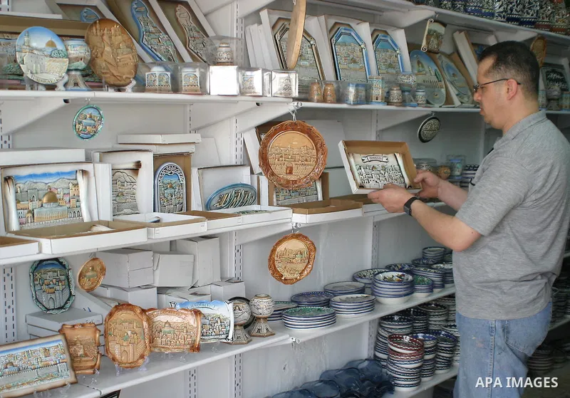 Palestinian Workers decorating and painting on the ceramics in the West Bank city of Hebron on June 10, 2009. This factory creates artifacts and Judaic made of glass and ceramics . these kinds of products are main produc...