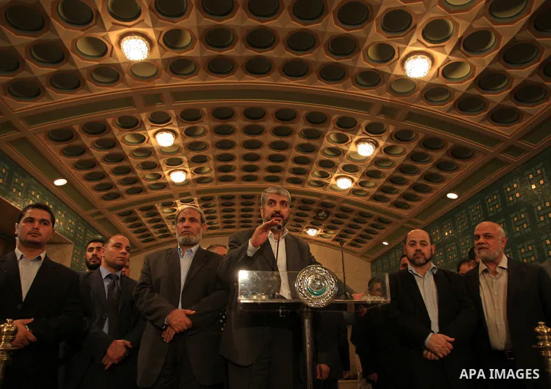 Palestinian Hamas leader Khaled Meshaal speaks during a joint press conference with Arab League Secretary General Amr Mussa (not seen) following their meeting at the institution's headquarters in Cairo on June 9, 2009. M...
