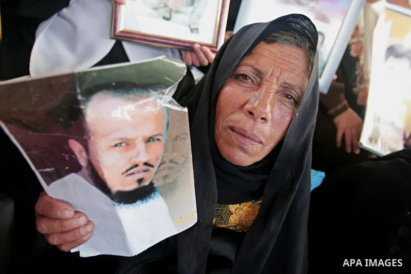 Palestinians hold up pictures of relatives during a rally calling for the release of Palestinian prisoners from Israeli jails in Gaza City on June 15, 2009. Currently Israel is holding 11,000 Palestinians in its jails Ph...