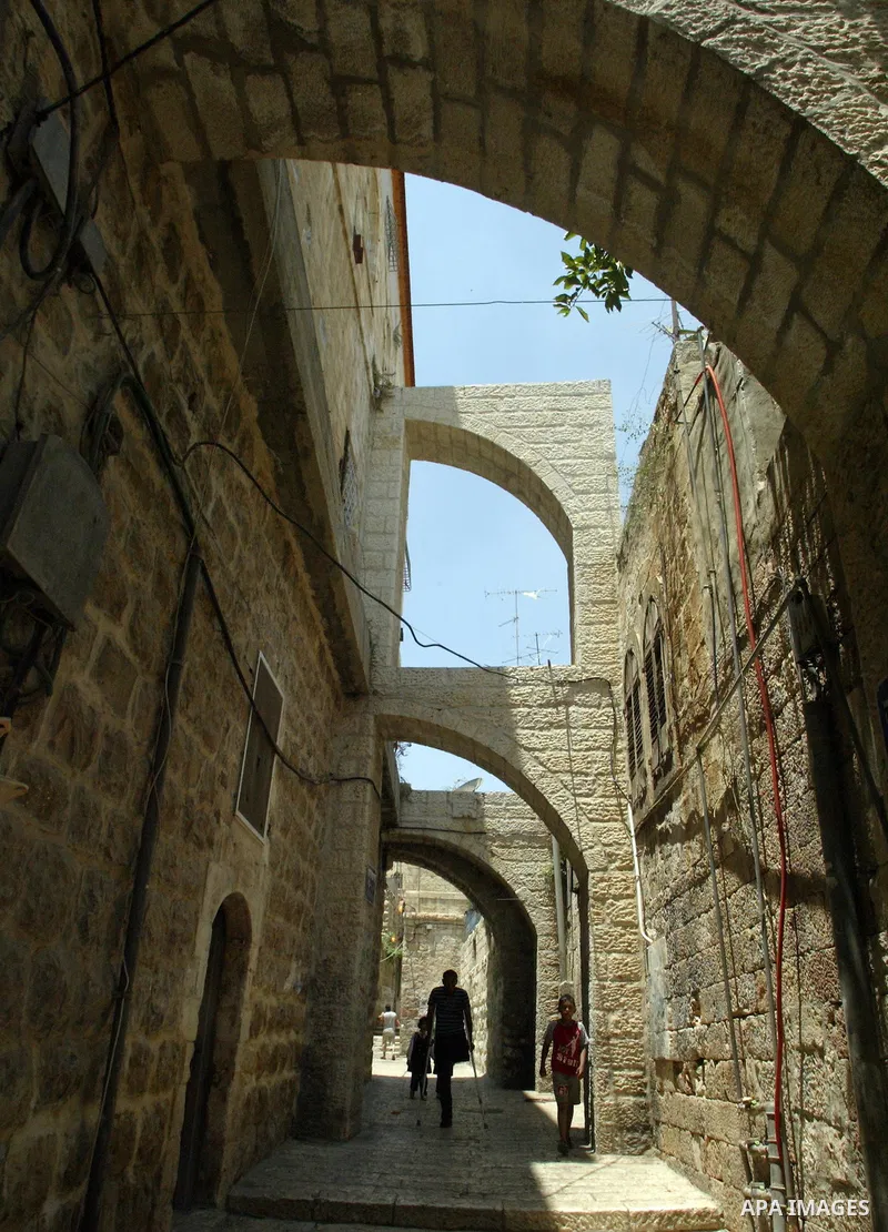 Palestinians shop at an traditional market at the old city of Jerusalem on June 17, 2009. PHOTO by Mahfuz Abu Turk