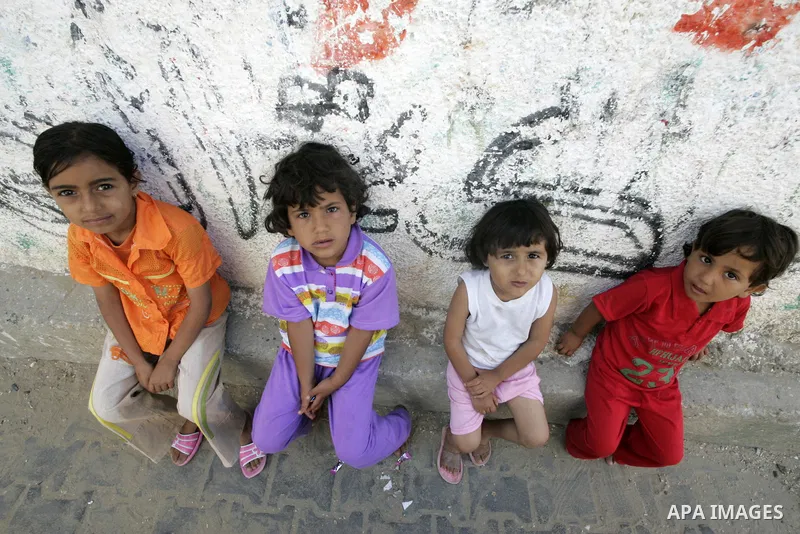 A Palestinian refugees children play at the street in the Rafah refugee camp southern Gaza Strip on 20 June 2009, the World Refugees Day. Palestinians around the world commemorate their displacement in 1948 as the world...