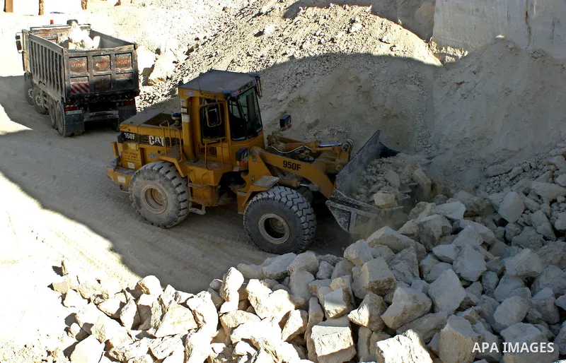 Palestinian laborers work at a quarry in the West Bank village of Bein Nea`am near Hebron on June 21, 2009. Stone and marble factories and quarries, located mainly in the West Bank cities of Hebron and Bethlehem, are at...