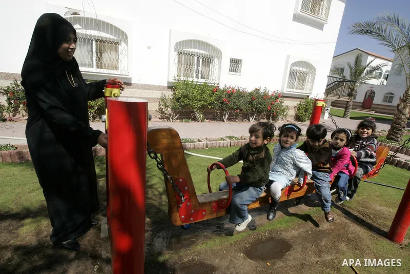 A Palestinian orphans play in the playground of the SOS Children's Village in Rafah the southern Gaza Strip on June 30, 2009. The school for orphans that was established in 2000 with the sponsorship of the Austrian SOS i...