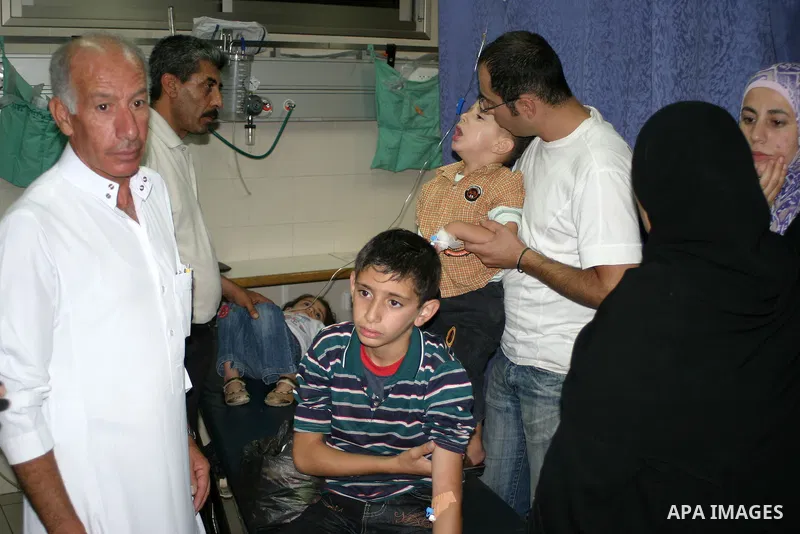 A Palestinians receive a medical treatment at a hospital due to a food poisoning in the town of Seier near the West Bank city of Hebron on July3, 2009. Photo by Najeh Hashlamoun