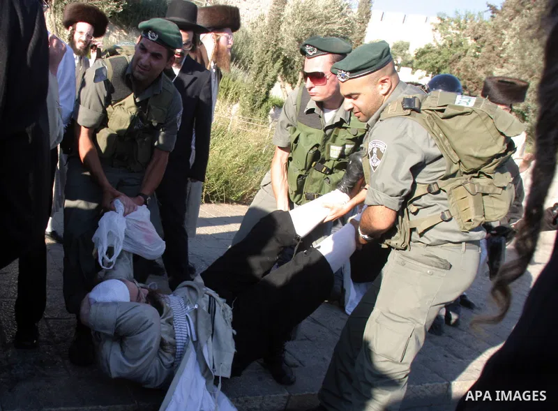 Ultra-Orthodox demonstrators scuffle with police during a protest in Jerusalem July 11, 2009 against the opening of a parking lot on the Jewish sabbath. Ultra-Orthodox Jews have clashed with police several times in the p...