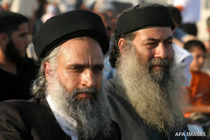 Palestinian supporters of Al-Tahrir Party, an international pan-Islamist party seeking to re-establish an international Islamic state, attend a rally in Bureij refugee camp, central Gaza Strip, Monday, July 20, 2009. Al-...