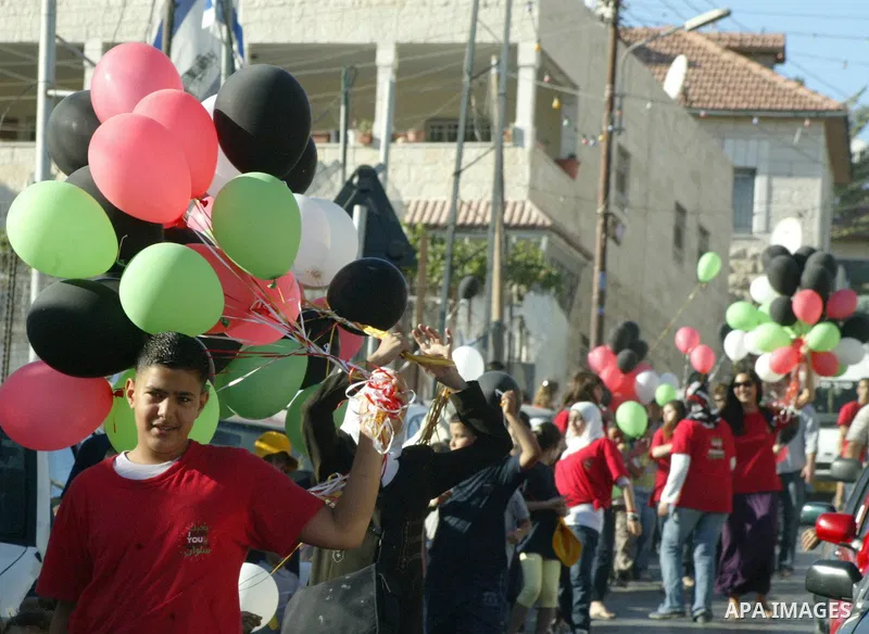 A Palestinian children attend a protest against the Israeli eviction policy in Silwan area in Jerusalem on Aug 7, 2009. Photo by Mahfouz Abu Turk