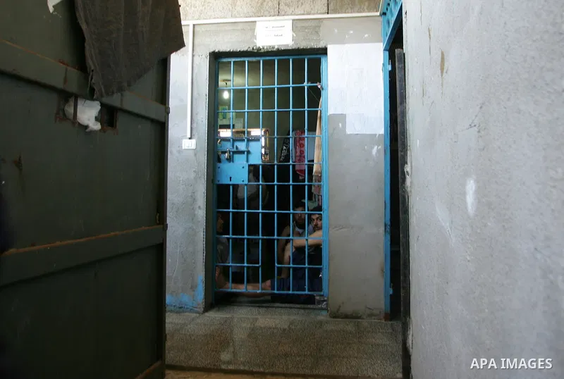 A Hamas police bring new inmates to the prison controlled by the Hamas police in Gaza City on August 11, 2009. The detention facility was opened after Gaza's main prison was destroyed during Israel's 22-day military offe...