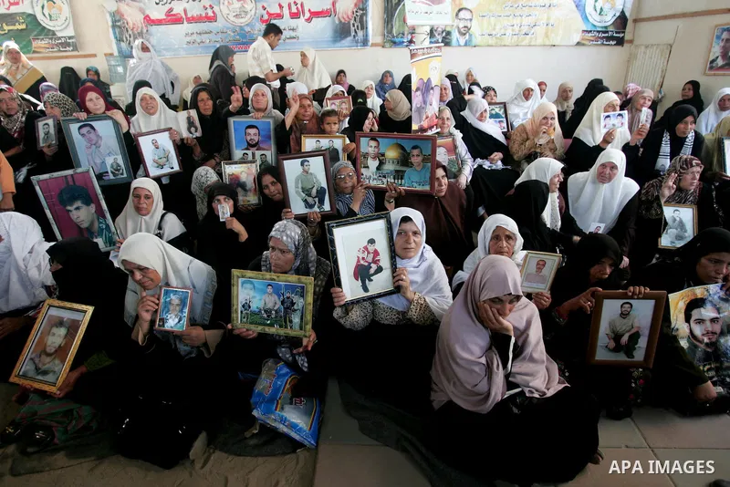 Palestinians take part in a protest in Gaza City calling for the release of Palestinian prisoners from Israeli jails August 17, 2009. Some 11,000 Palestinians are in Israeli prisons and securing their freedom is a highly...