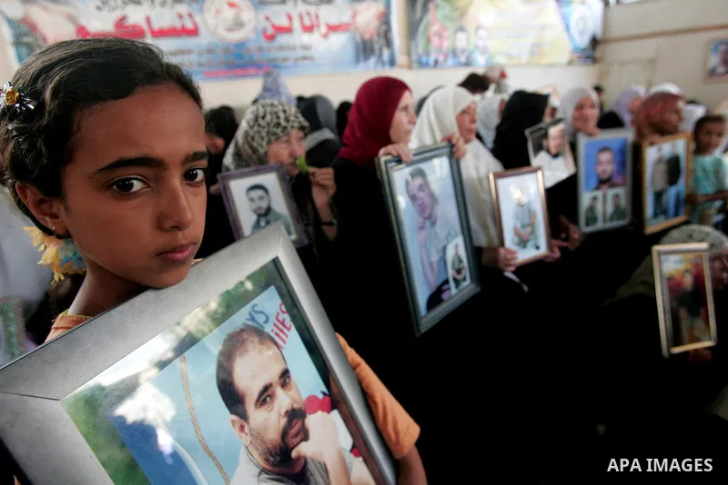 Palestinians take part in a protest in Gaza City calling for the release of Palestinian prisoners from Israeli jails August 17, 2009. Some 11,000 Palestinians are in Israeli prisons and securing their freedom is a highly...