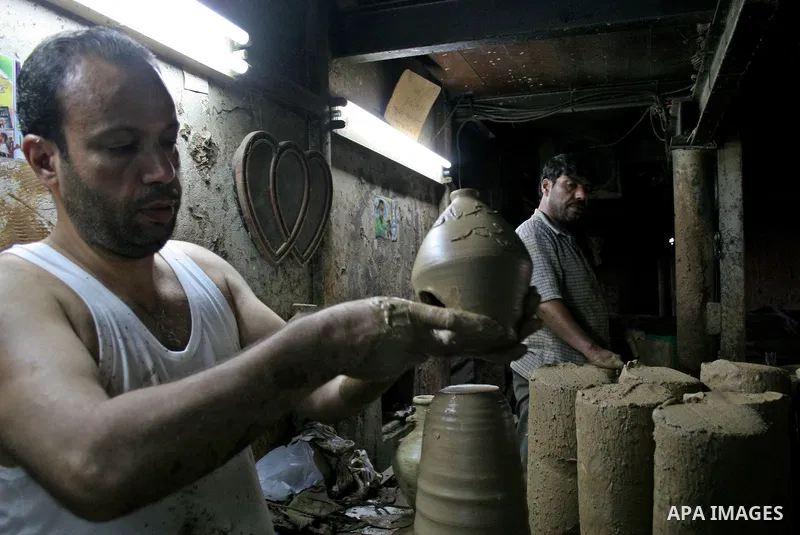 A Palestinian potter makes a clay lantern at his workshop in Gaza City on Aug 18, 2009, ahead of the start of the holy month of Ramadan during which Muslims fast from dusk to dawn and give alms to the poor. The Arabic ex...