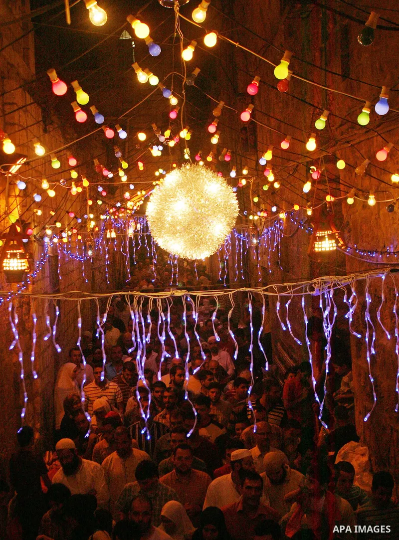 A Palestinians walks at a popular market decorated with a festive lights ahead of the Islamic holy month Ramadan in Jerusalem's old city on August 21, 2009. The Muslim holy month of Ramadan begins Saturday 22 August, is...