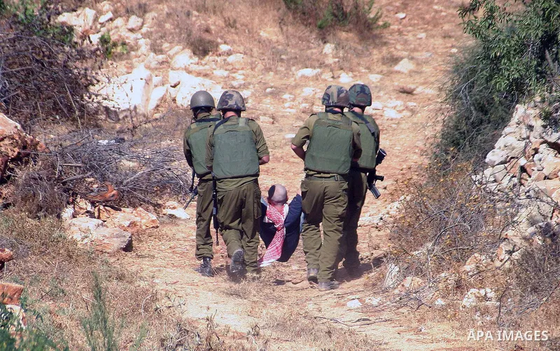 Israeli soldiers disperse protesters who were demanding the right of Palestinian farmers to Confiscation of land for farmers and cultivate their land during a demonstration on farming land near the Jewish settlement of K...