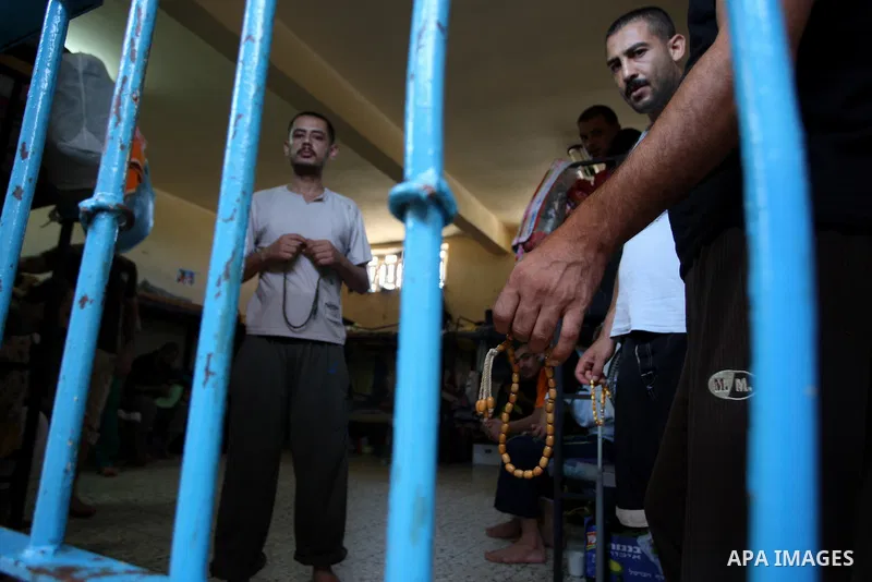 Palestinian prisoners stand inside the new Hamas police controlled jail in Gaza City 21 August 2009. A Hamas jail was built after Gaza's main prison was destroyed during the three-week offensive Israel launched against H...