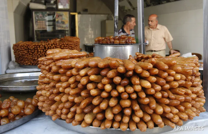 A Palestinian sweet maker prepares pancakes on the Second day of Ramadan, the holy fasting month, in the West Bank city of Nablus on Aug 23, 2009. During Ramadan, Muslims are required to abstain from food, drink and sex...