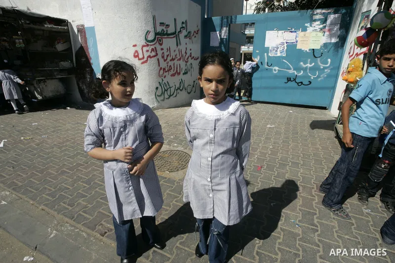 Palestinian students return to their school in the first day of new school year in Rafah, southern Gaza Strip on August 23, 2009. The academic year began in the Gaza Strip on August 23, a week earlier than in the West Ba...