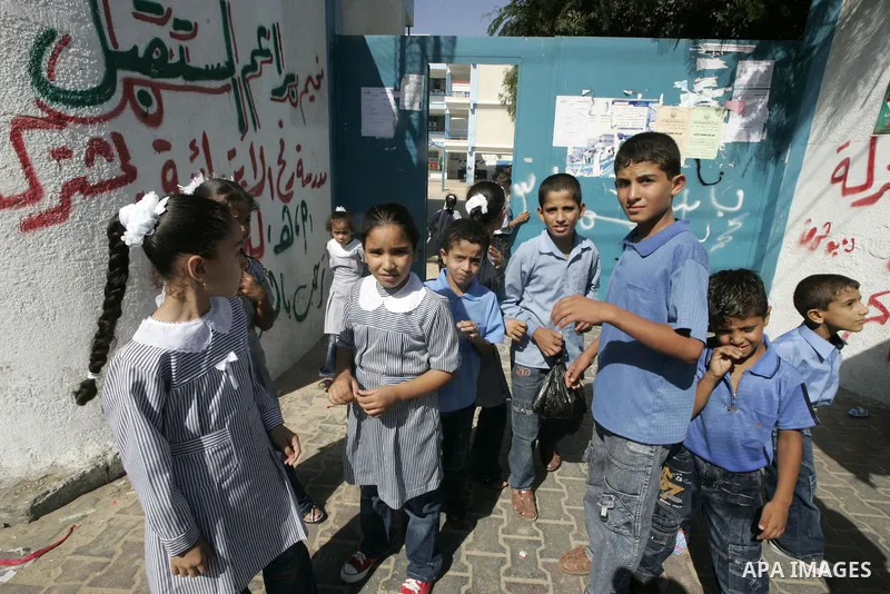 Palestinian students return to their school in the first day of new school year in Rafah, southern Gaza Strip on August 23, 2009. The academic year began in the Gaza Strip on August 23, a week earlier than in the West Ba...
