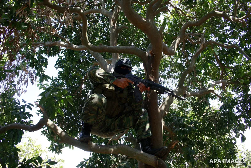 A militants of Al-Nasser Salah Al-Deen brigades attend a military training in Gaza city on Aug 27,2009..A Palestinian were killed during Israeli incursion northern Gaza strip, The militants said that they expect a wide I...