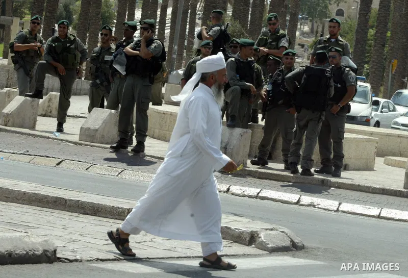A Palestinians walk to attend the first Friday prayers of the Muslim holy month of Ramadan in al-Aqsa mosque in the old city of Jerusalem on Aug 28, 2009. Muslims around the world abstain from eating, drinking and sexual...