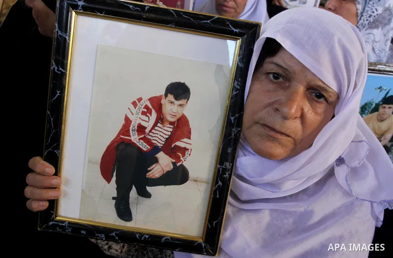 Palestinians hold pictures of their relatives jailed in Israeli prisons during a protest in Gaza City on August 31, 2009 to call for their release. Currently Israel is holding 11,000 Palestinians in its jails. Photo By M...