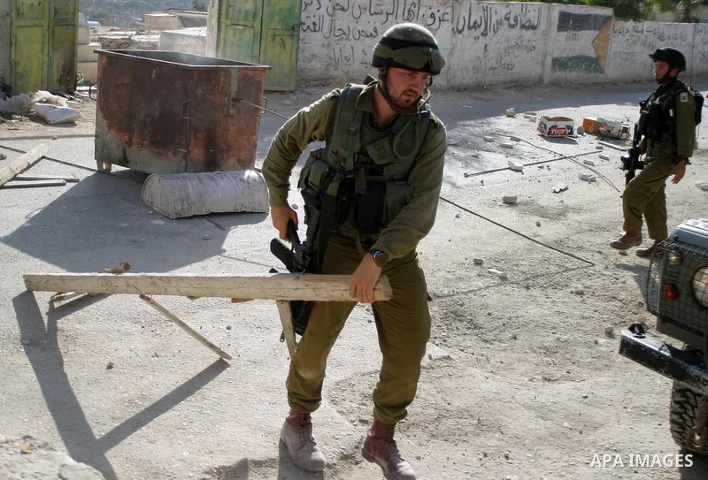 Israeli soldiers during a military operation in the village of Beit Ula West the West Bank city of Hebron, on Sep 22, 2009. Photo by Najeh Hashlamoun