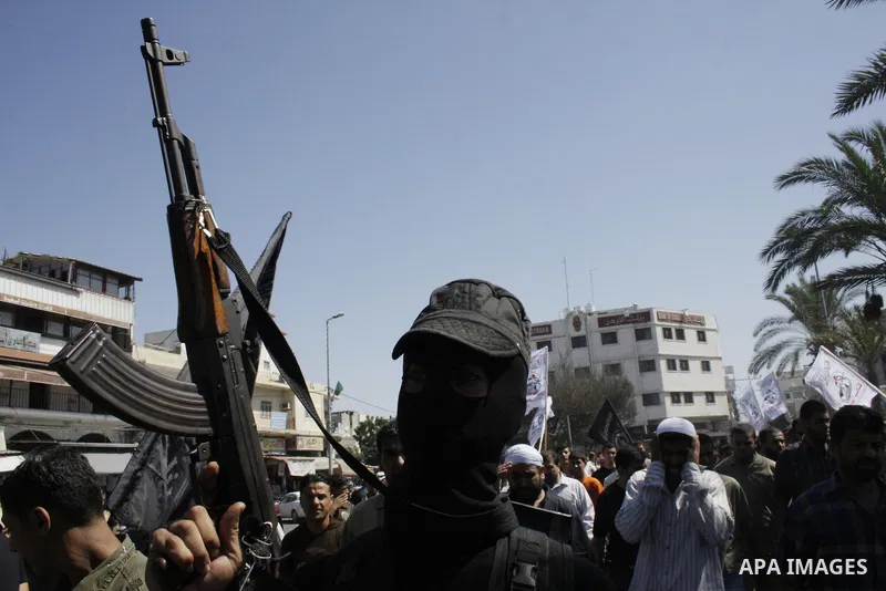 Palestinian Islamic Jihad militants attend the funeral for three militants killed in an airstrike the previous day in Gaza City, Gaza Strip on 26 September 2009. Three Islamic Jihad militants were killed in an Israeli mi...