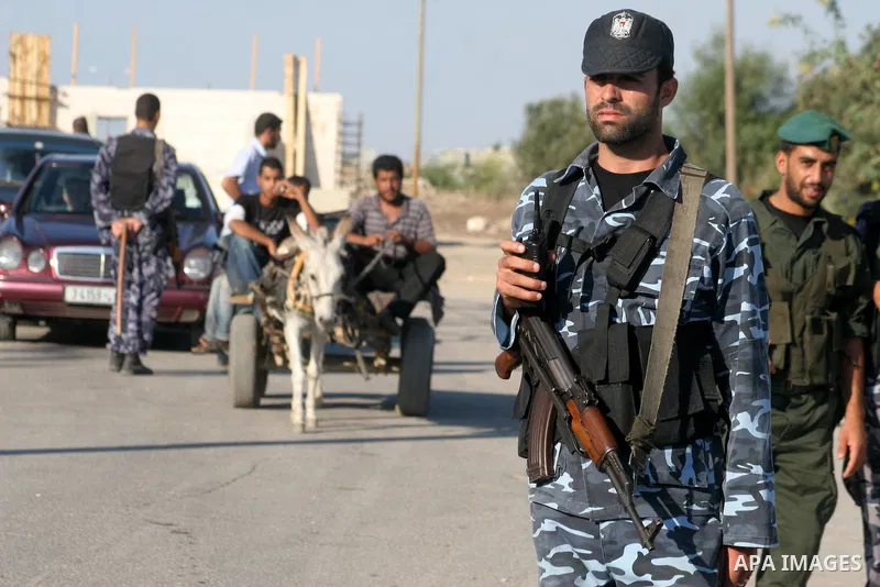 Hamas policeman wait near the Israeli Erez border crossing on October 1, 2009 for the release of Palestinian prisoners currently held in Israeli jails. On October 20 Israel is due to free 20 women, in return for a videot...
