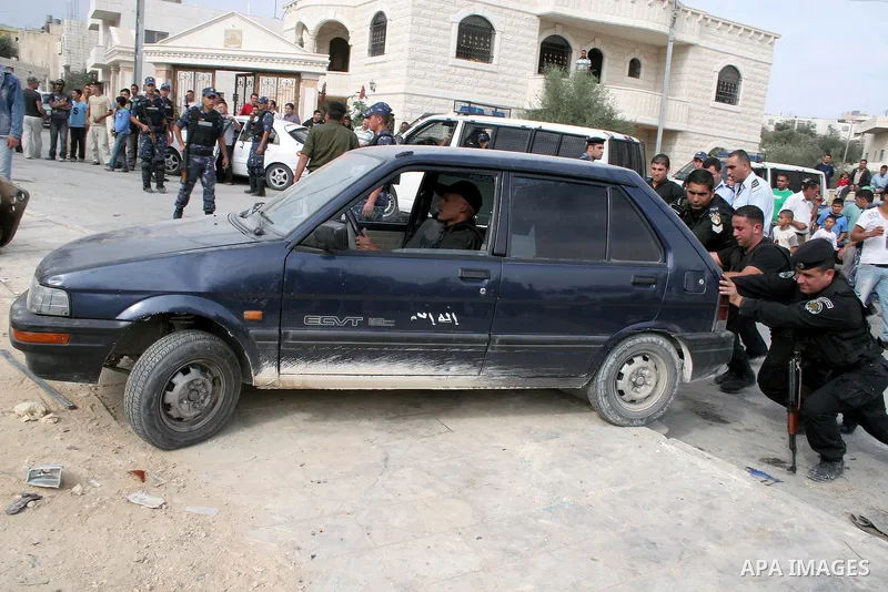 Palestinian policemen destroy stolen cars during a continuing crackdown on stolen vehicles, illegally brought into the Palestinian territories in the West Bank town of Beit Fajjar near Bethlehem on October 21, 2009. More...