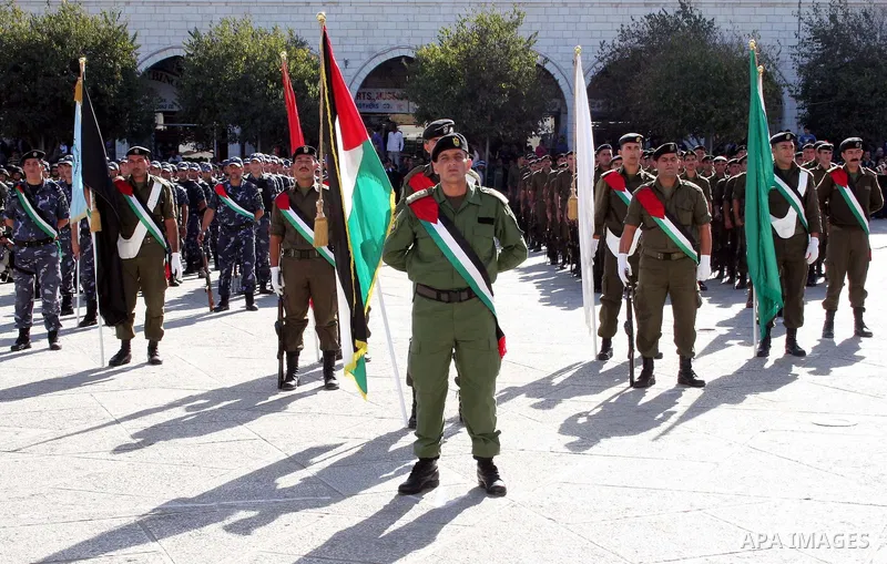 Members of Palestinian security forces take part in a march to mark the 21st anniversary of the self-declared Palestinian Independence Day in the West Bank city of Bethlehem, Sunday, Nov 15, 2009. Palestinians have marke...