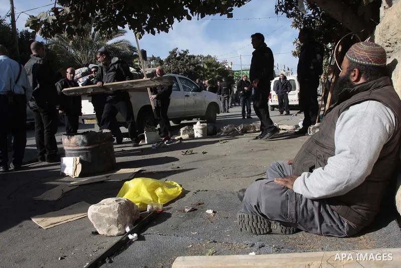A Jewish settlers carry a box with belongings of a Palestinian family into a tent after they took over the family's house in the Arab east Jerusalem neighborhood of Sheikh Jarrah on December 02, 2009. photo by Muammar Aw...