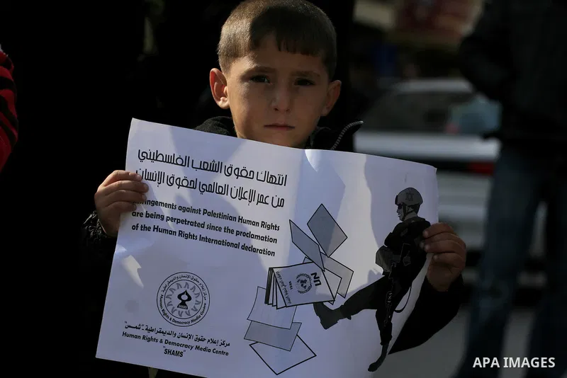 Palestinians attend a demonstration in the day of universal declaration of human rights in the west bank city of Ramallah on Dec 10, 2009. Photo by Issam Rimawi