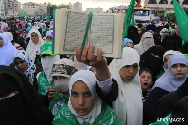 Palestinian Hamas supporters attend a rally in Gaza City on December 14, 2009 marking the 22nd anniversary of the Islamist movement's founding. Hamas Prime Minister Ismail Haniya told tens of thousands of Hamas supporter...