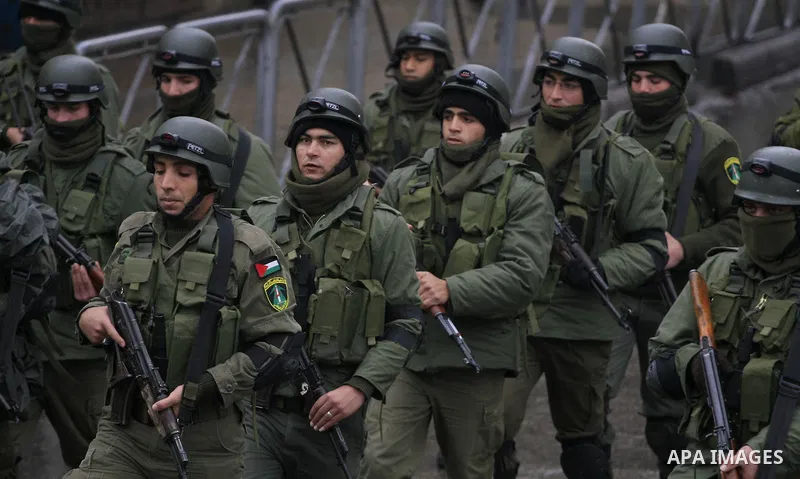 A members of the Palestinian security forces march during a military showing in the west Bank city of Ramallah on Dec 18, 2009. Photo by Issam Rimawi